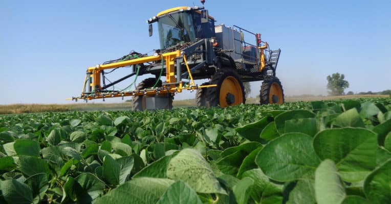 sprayer in soybean field applying micronutrients