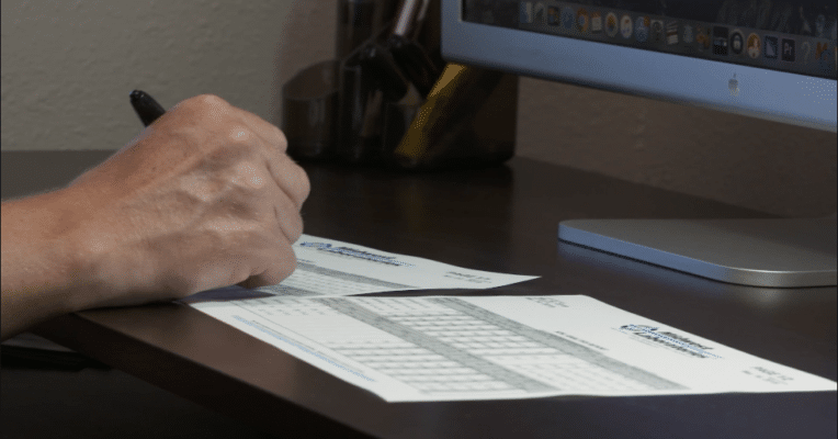 Farmer reviewing his soil test analysis in his home office.