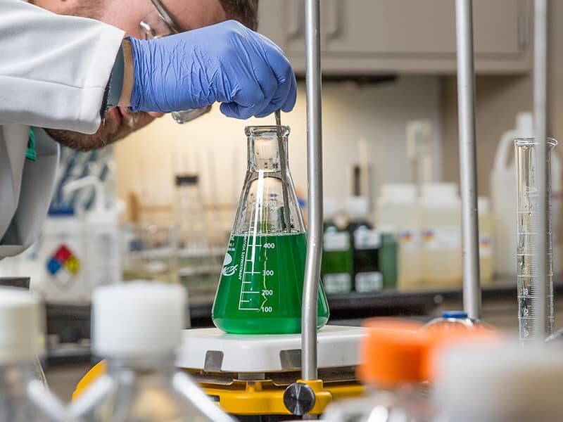 AgroLiquid scientist testing in the lab