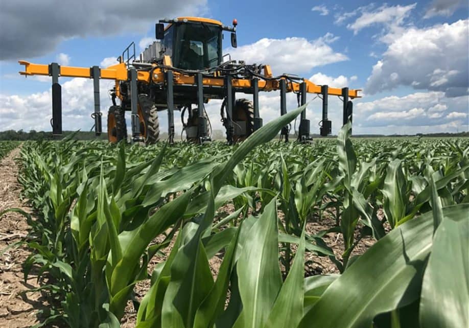 Tractor spraying field